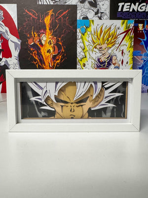 Light box con Goku Ultra Istinto Dragon Ball in cornice bianca, sfondo anime colorato