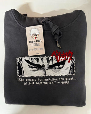 Felpa nera ricamata con occhi di Guts Berserk e scritta in inglese, etichetta anime.