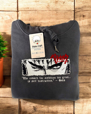 Felpa nera ricamata con occhi di Guts di Berserk, frase motivazionale e logo rosso anime.