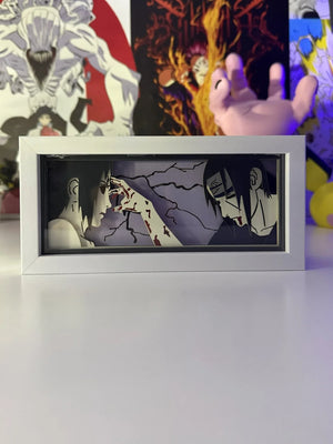 Light box LED con Itachi e Sasuke di Naruto, scena iconica anime, cornice bianca.