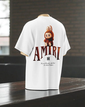 T-shirt oversize bianca con stampa grande di personaggio cartoon marrone e scritta AMIRI sul retro.