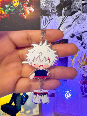 Portachiavi anime Satoru Gojo Jujutsu Kaisen in stile chibi, sfondo manga colorato.